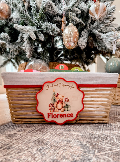 Wooden Christmas delivery plaque with teddy bear and gifts design, personalised with red acrylic name