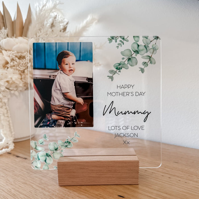 Clear arcrylic photo plaque with a childs photo and happy mothers day writren on it