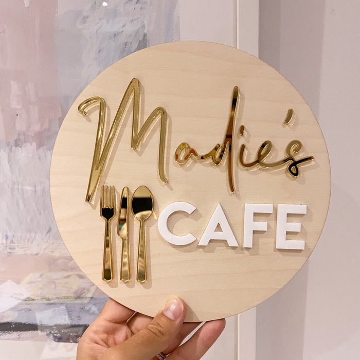 A kids cafe sign personalised with a child name in mirror finish gold