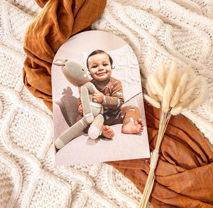 Photo of a young boy on a arch shaped photo block