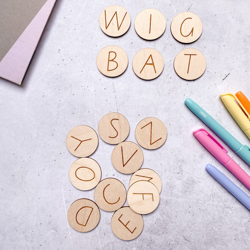 Upper Case Alphabet Letter Tiles on a teachers desk.