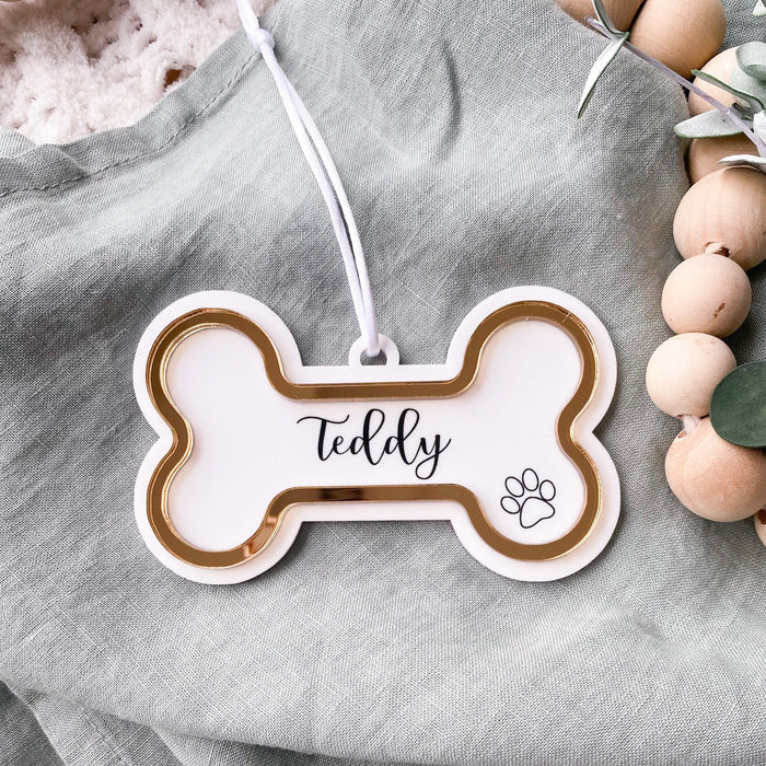 Dog boned shaped Christmas tree decoration personalised with a dogs name and paw print
