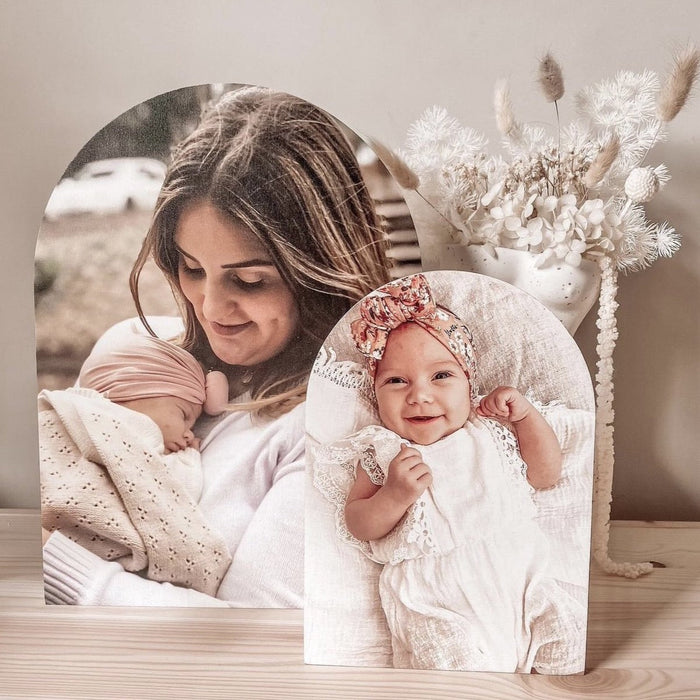A mother and child photos in two arch shaped photo blocks displayed in different sizes.