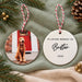 Front and back of the ceramic bauble, with the dog's photo on one side and In Loving Memory Of Buster 2026 on the other