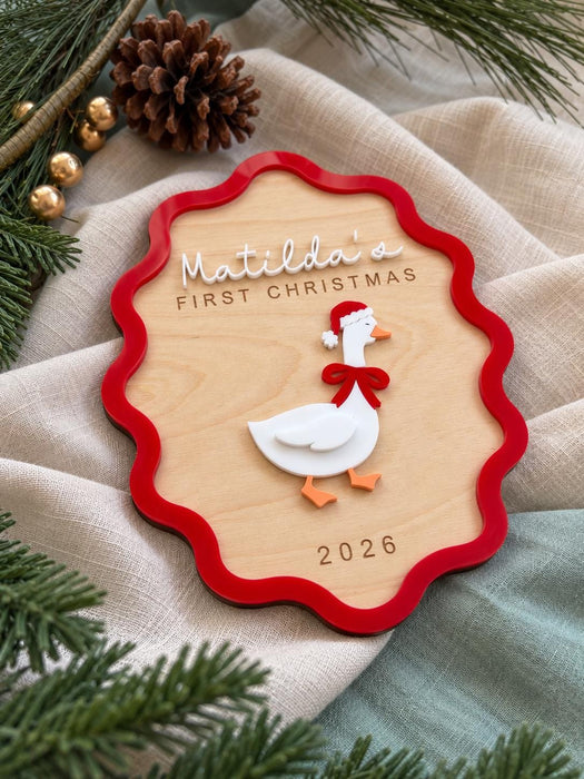 First Christmas goose sign for Matilda with 2026 engraved, styled with pine and gold baubles