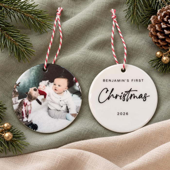 Front and back of the ceramic bauble, with the baby photo on one side and Benjamin's First Christmas 2026 on the other